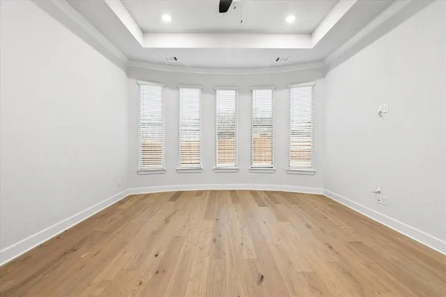 a bathroom with a double vanity sink mirror and bathtub