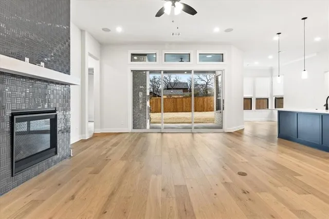 a view of an empty room with a fireplace