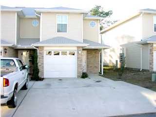 478 Keystone Road, Unit 6B Mary Esther, FL 32569 - Photo 1 of 1 a view of a house with a garage