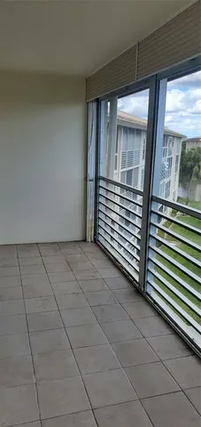 a view of an empty room with closet