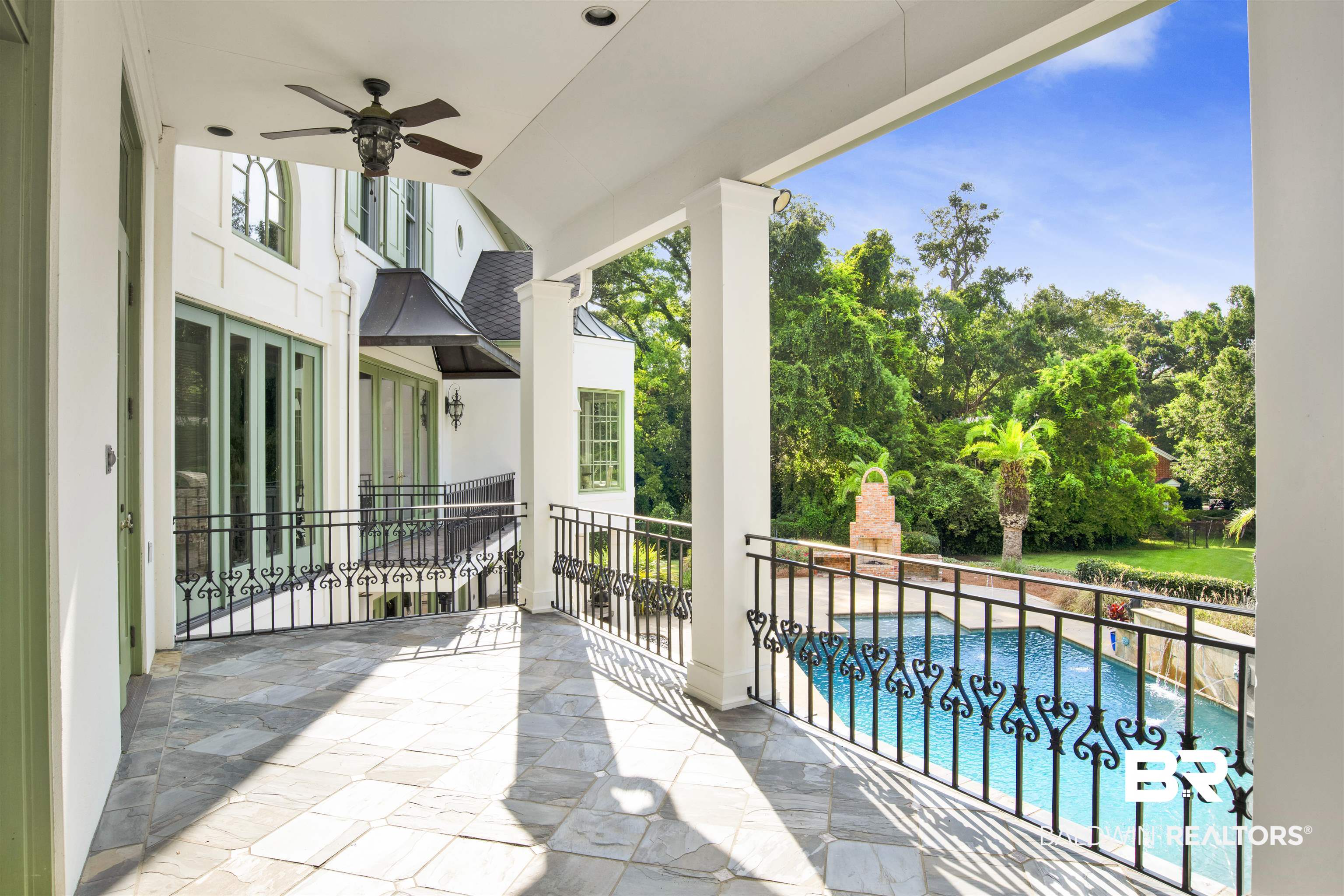3816 Austill Lane Mobile, AL 36608 - Photo 55 of 80 Balcony with view of pool, view of wooded area, and a ceiling fan