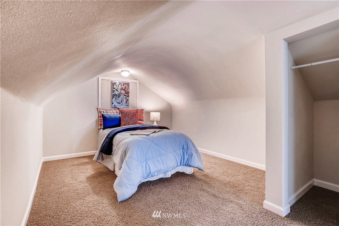 718 North 30th Street Renton, WA 98056 - Photo 14 of 21 a bedroom with a bed and a window