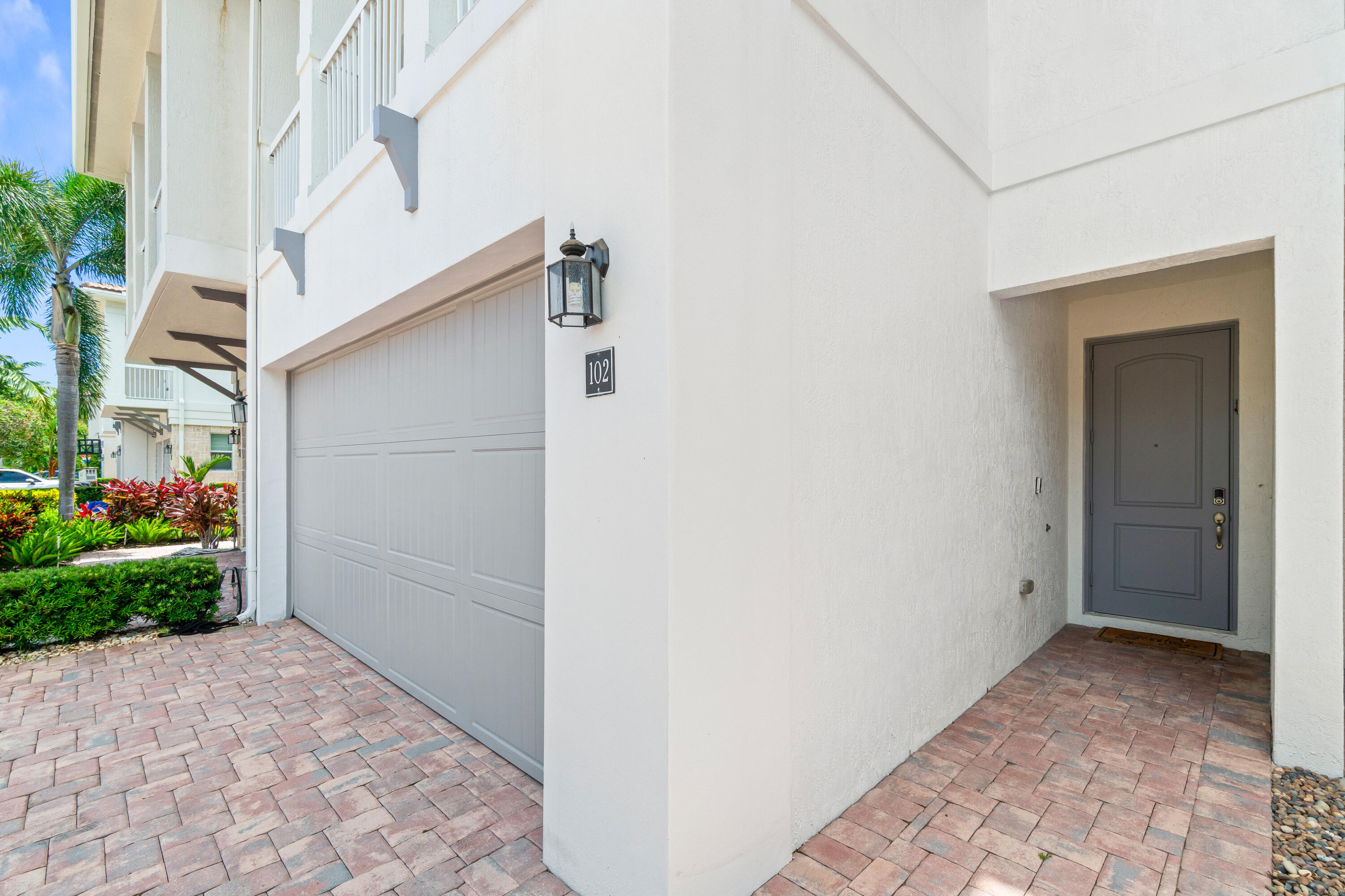 100 Northwest 69th Circle, Unit 102 Boca Raton, FL 33487 - Photo 3 of 33 Garage/Entry