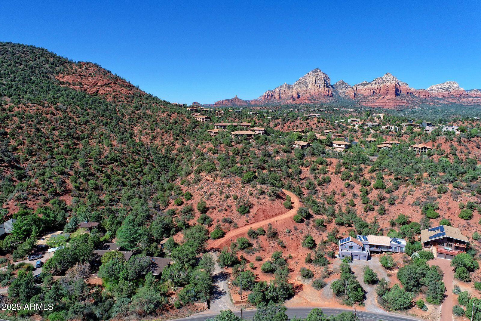 463 Brewer Road Sedona, AZ 86336 - Photo 1 of 22 an aerial view of residential houses with outdoor space and trees