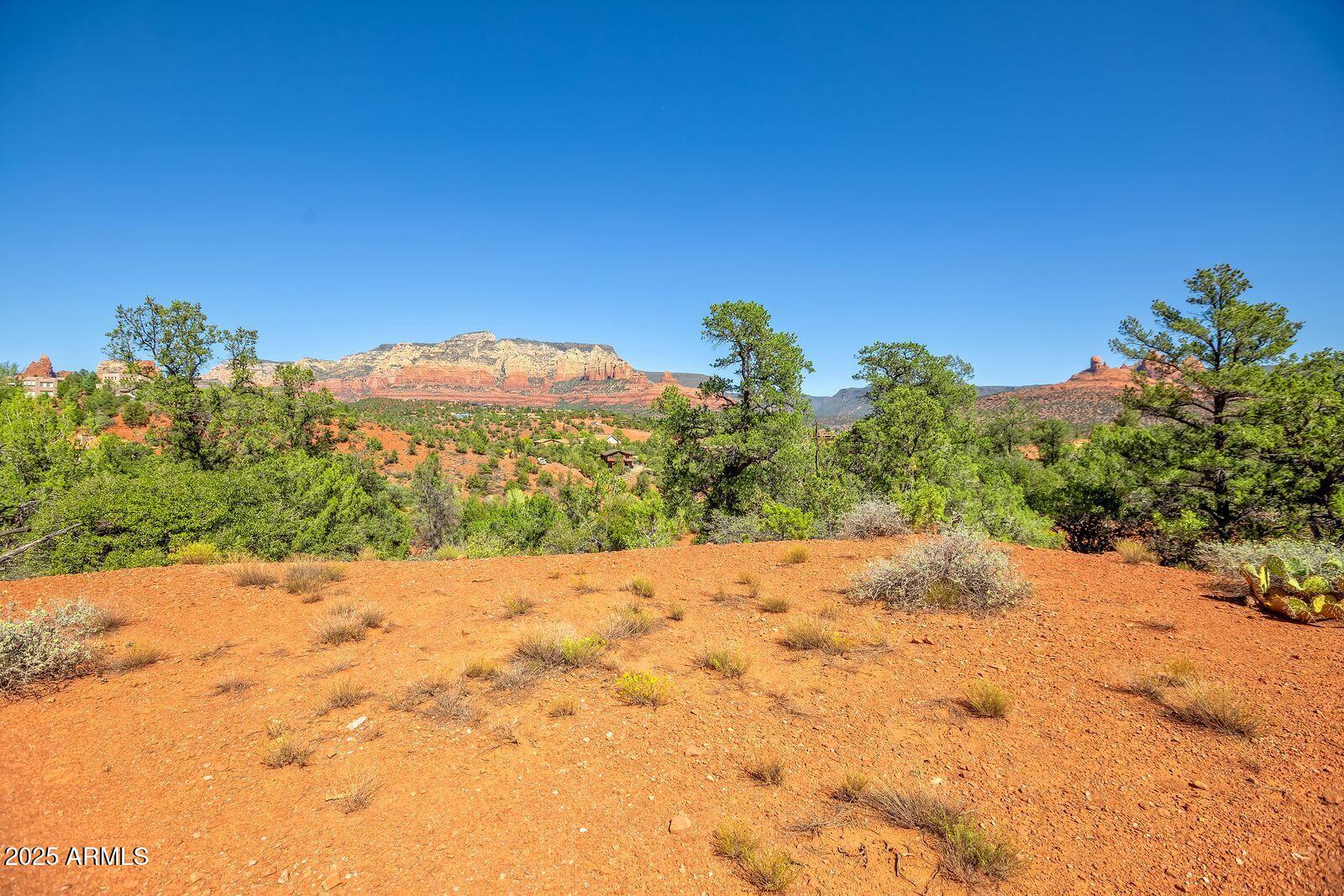 463 Brewer Road Sedona, AZ 86336 - Photo 7 of 22 a view of a road with a yard