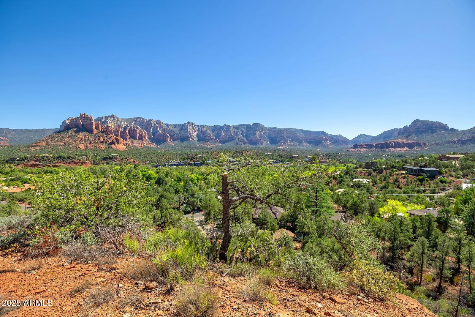 463 Brewer Road Sedona, AZ 86336 - Photo 9 of 22 a view of a lush green hillside and a building