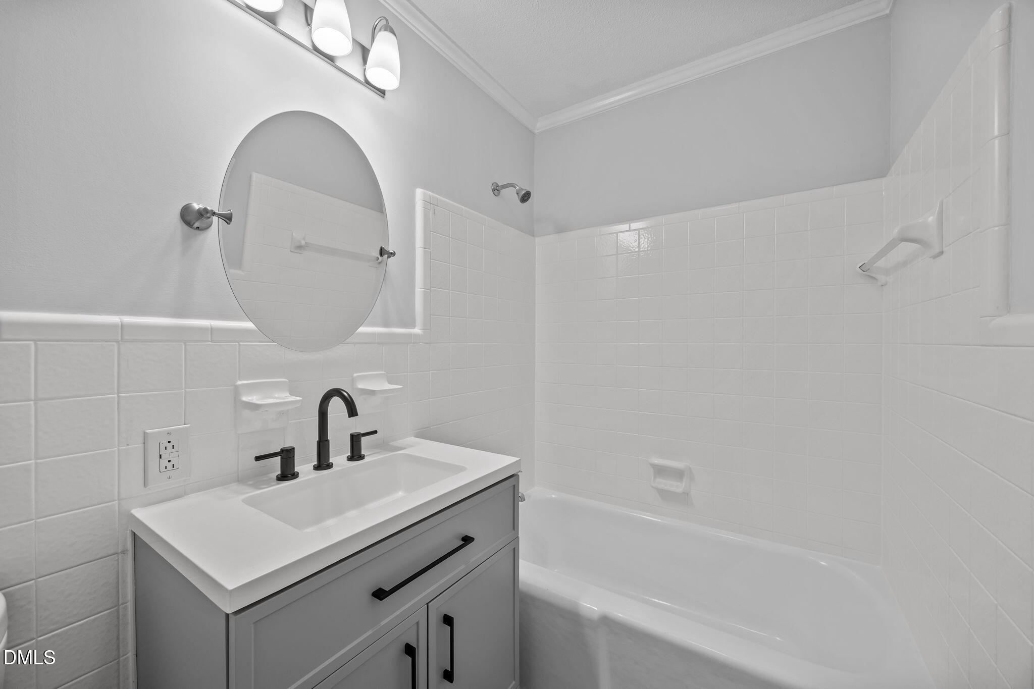 1341 Bear Trap Road Williamston, NC 27892 - Photo 17 of 42 a bathroom with a sink a vanity a mirror and vanity