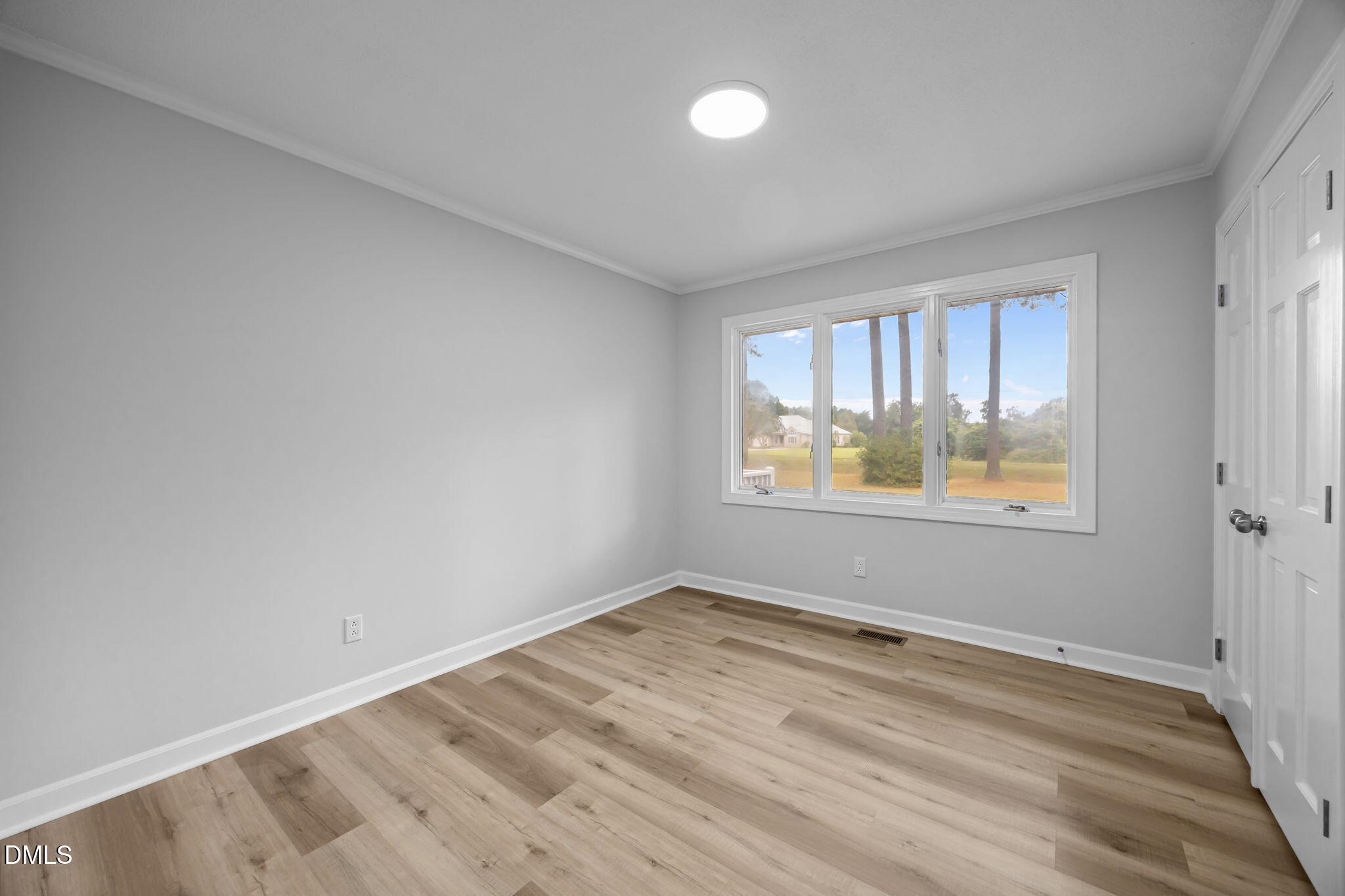1341 Bear Trap Road Williamston, NC 27892 - Photo 21 of 42 wooden floor in an empty room with a window