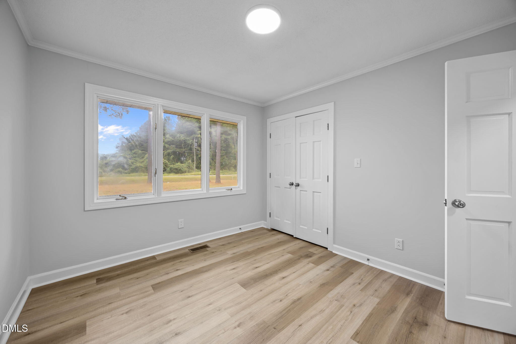 1341 Bear Trap Road Williamston, NC 27892 - Photo 22 of 42 wooden floor in an empty room with a window