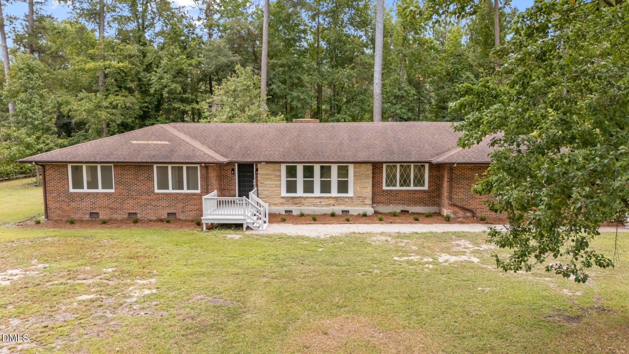1341 Bear Trap Road Williamston, NC 27892 - Photo 39 of 42 a front view of a house with a garden and porch
