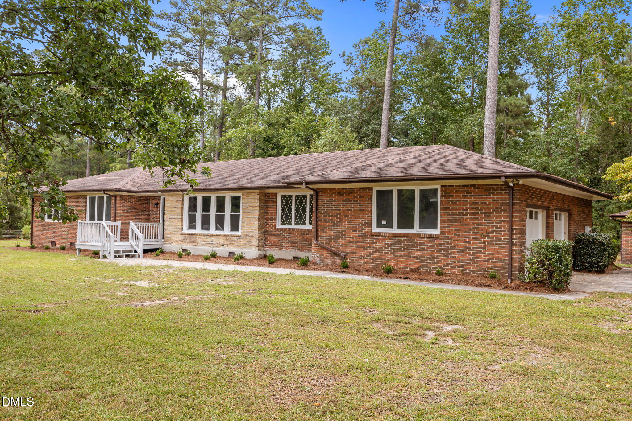 1341 Bear Trap Road Williamston, NC 27892 - Photo 40 of 42 a front view of a house with a garden and porch