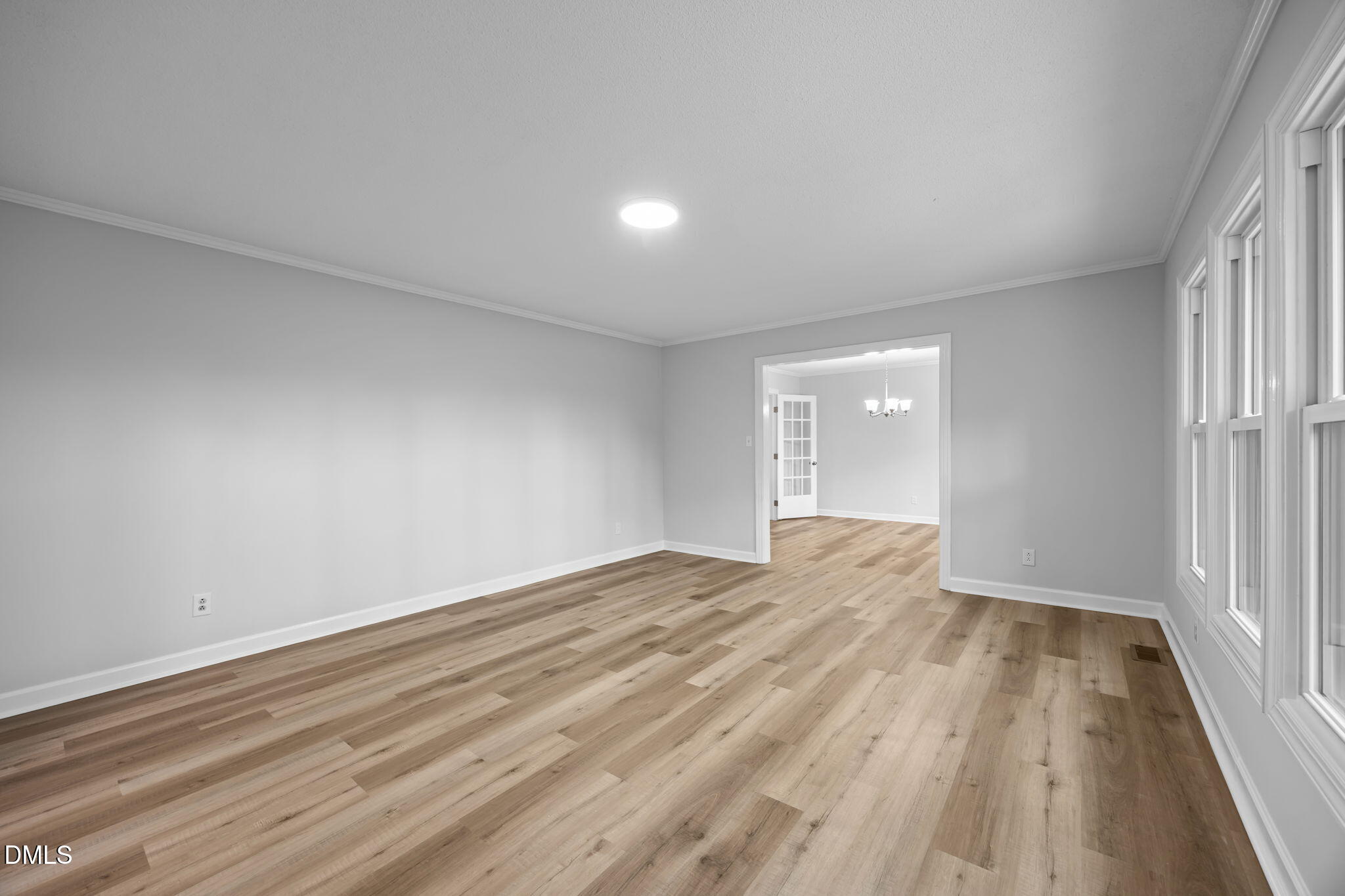 1341 Bear Trap Road Williamston, NC 27892 - Photo 5 of 42 an empty room with wooden floor and windows