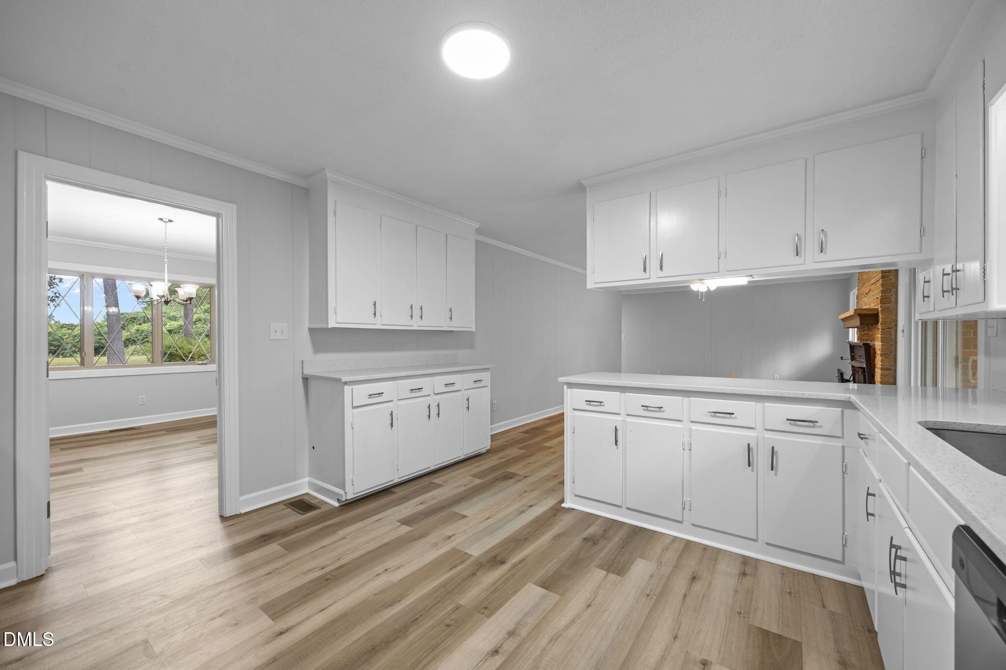 1341 Bear Trap Road Williamston, NC 27892 - Photo 10 of 42 a kitchen with granite countertop white cabinets and white appliances