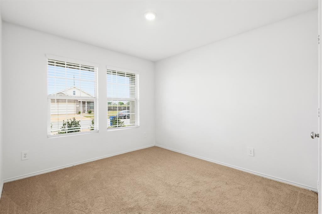 2604 Spring Time Drive Ennis, TX 75119 - Photo 3 of 21 an empty room with a window