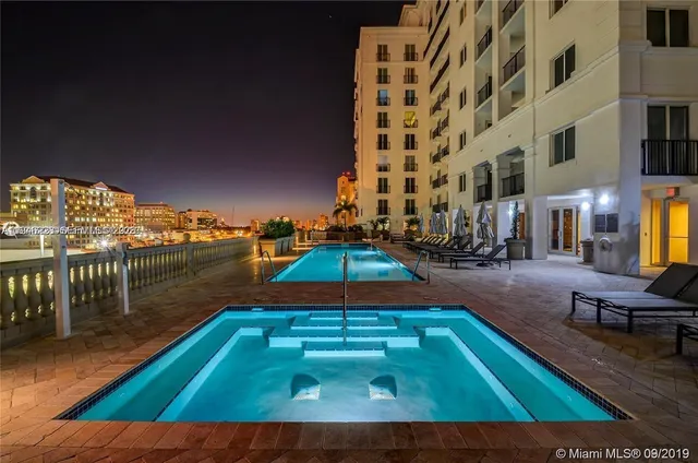 a view of a chairs and table in patio