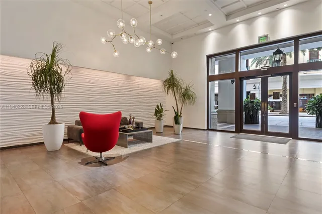 a kitchen with stainless steel appliances a stove a sink and a microwave