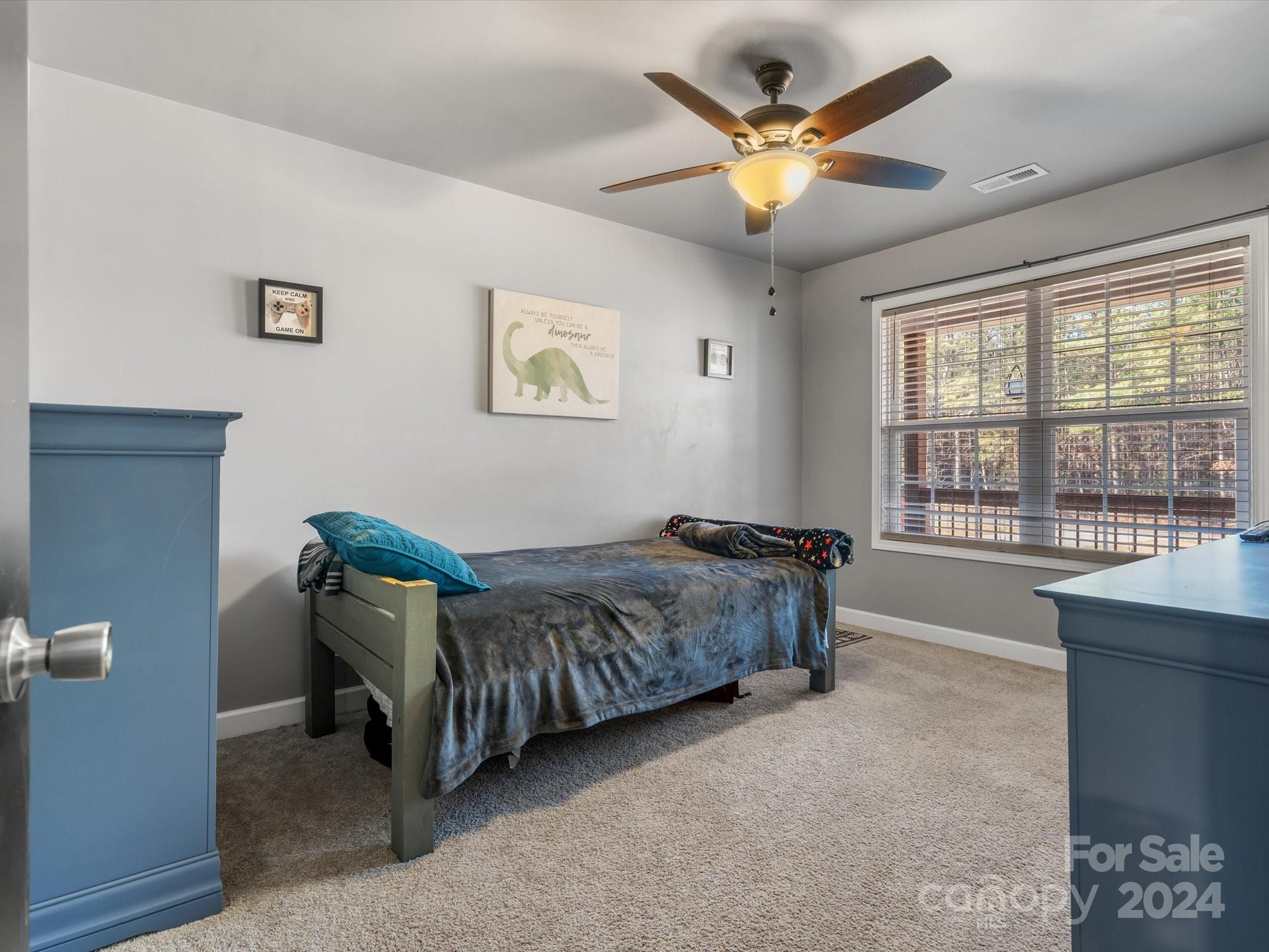 1128 State Rd S-46-817 York, SC 29745 - Photo 14 of 22 a living room with a bed furniture and a large window