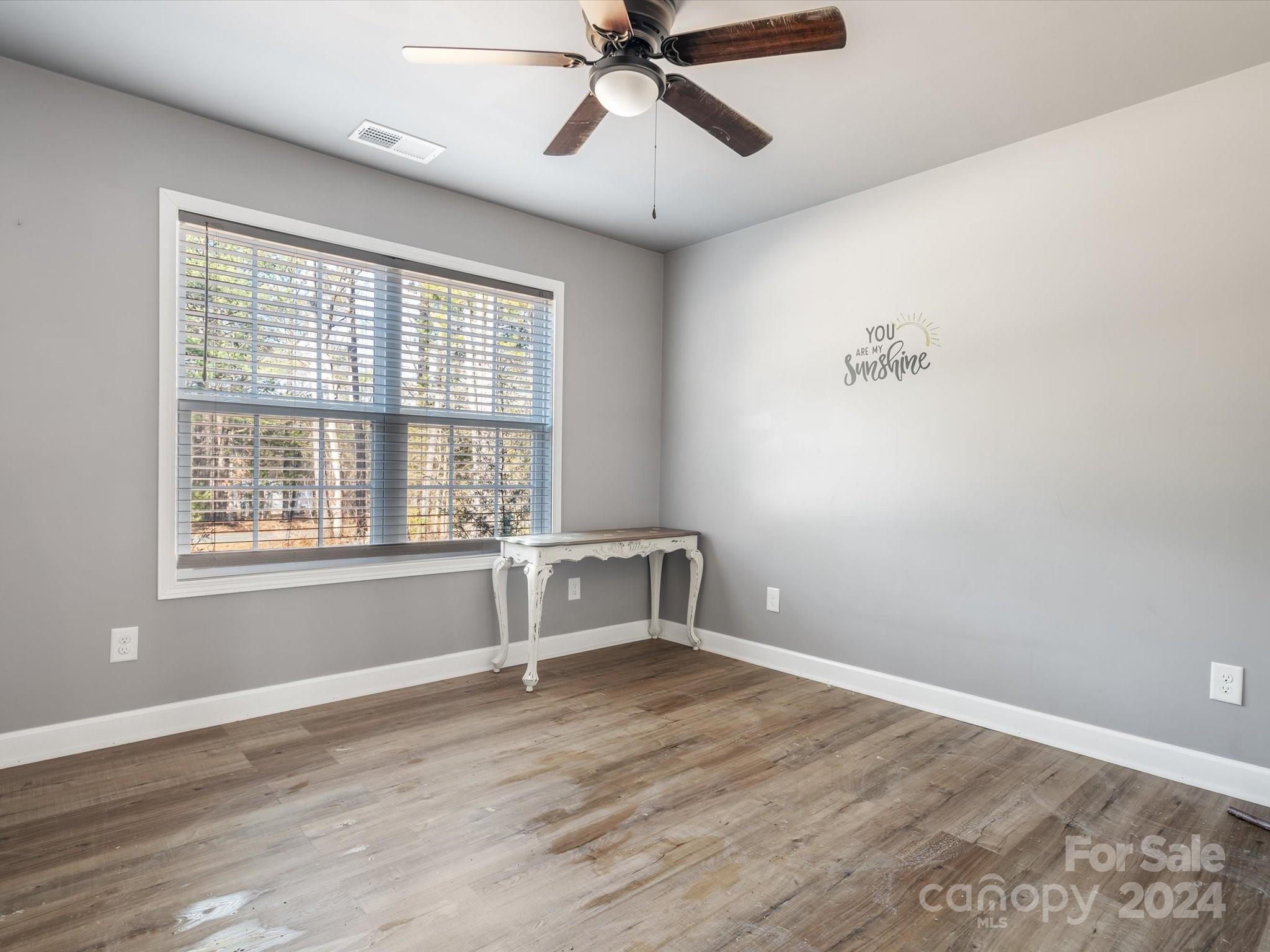 1128 State Rd S-46-817 York, SC 29745 - Photo 15 of 22 a view of an empty room with a window and wooden floor