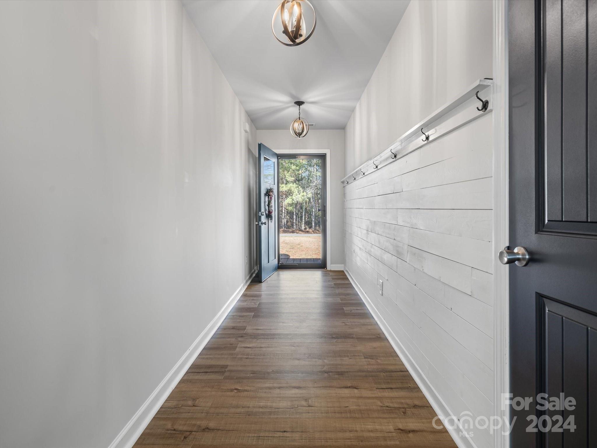 1128 State Rd S-46-817 York, SC 29745 - Photo 2 of 22 a view of a hallway with wooden floor and staircase