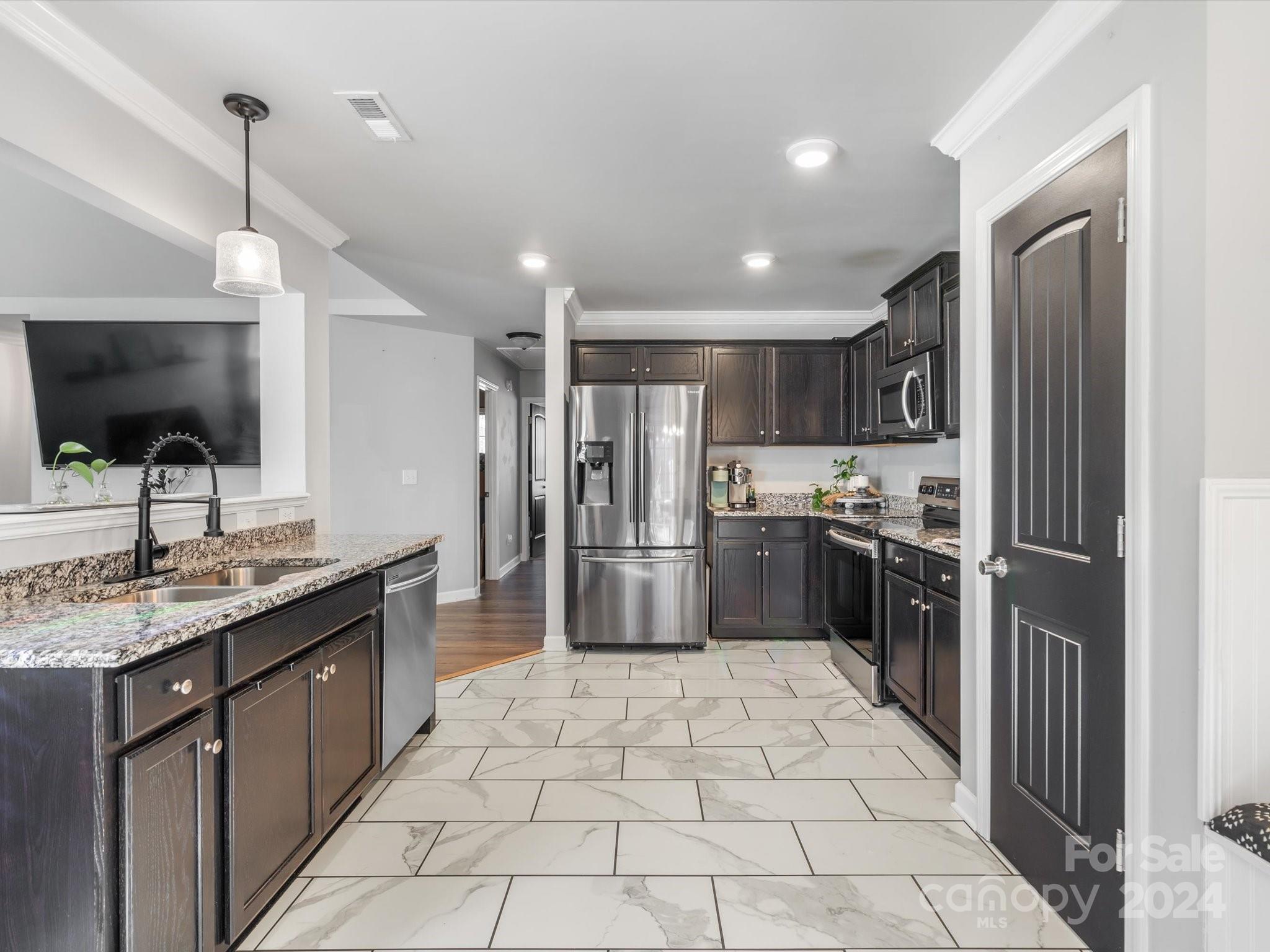 1128 State Rd S-46-817 York, SC 29745 - Photo 7 of 22 a kitchen with stainless steel appliances granite countertop a refrigerator and a sink