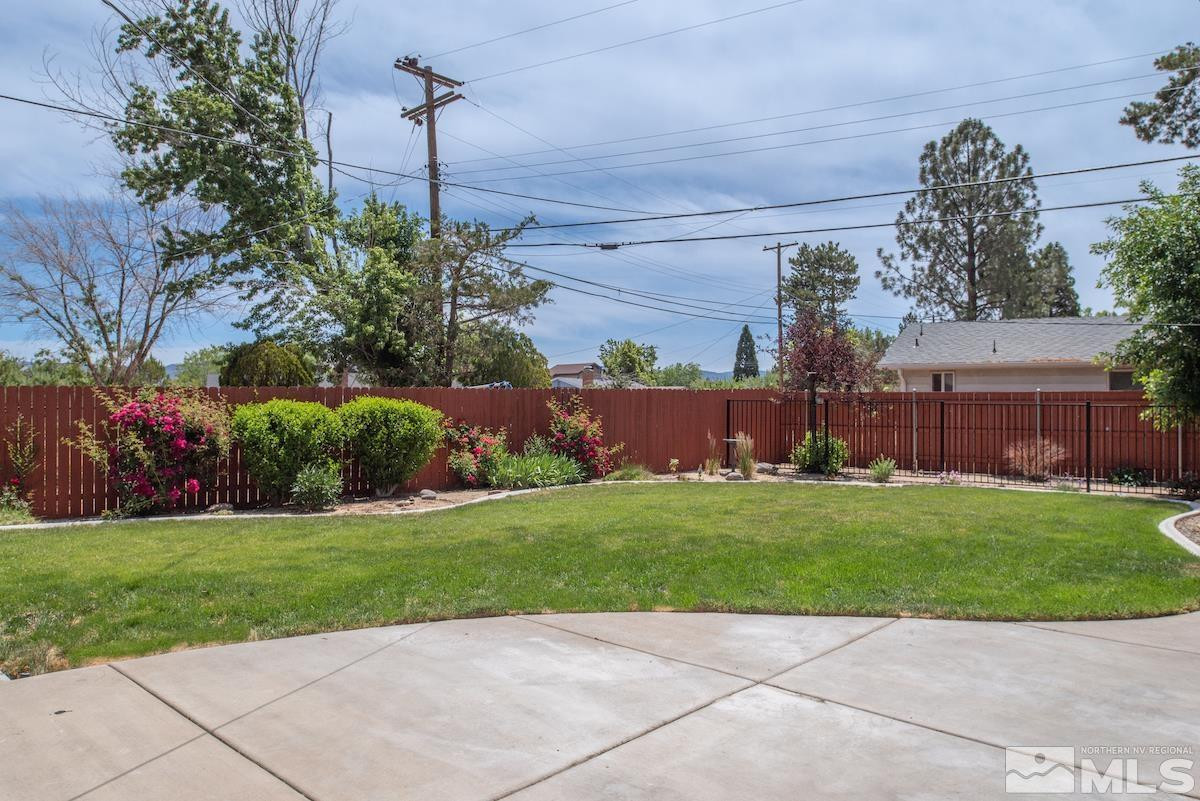 3900 Warren Way Reno, NV 89509 - Photo 29 of 29 a backyard of a house with plants and large tree