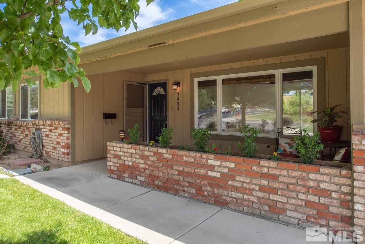 3900 Warren Way Reno, NV 89509 - Photo 8 of 29 a view of house with backyard outdoor seating and potted plants