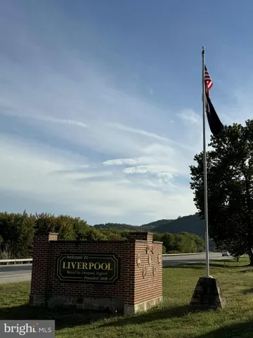 a view of a street with an ocean view