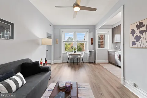 a view of a livingroom with furniture and a window