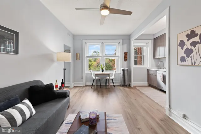 a view of a livingroom with furniture and a window