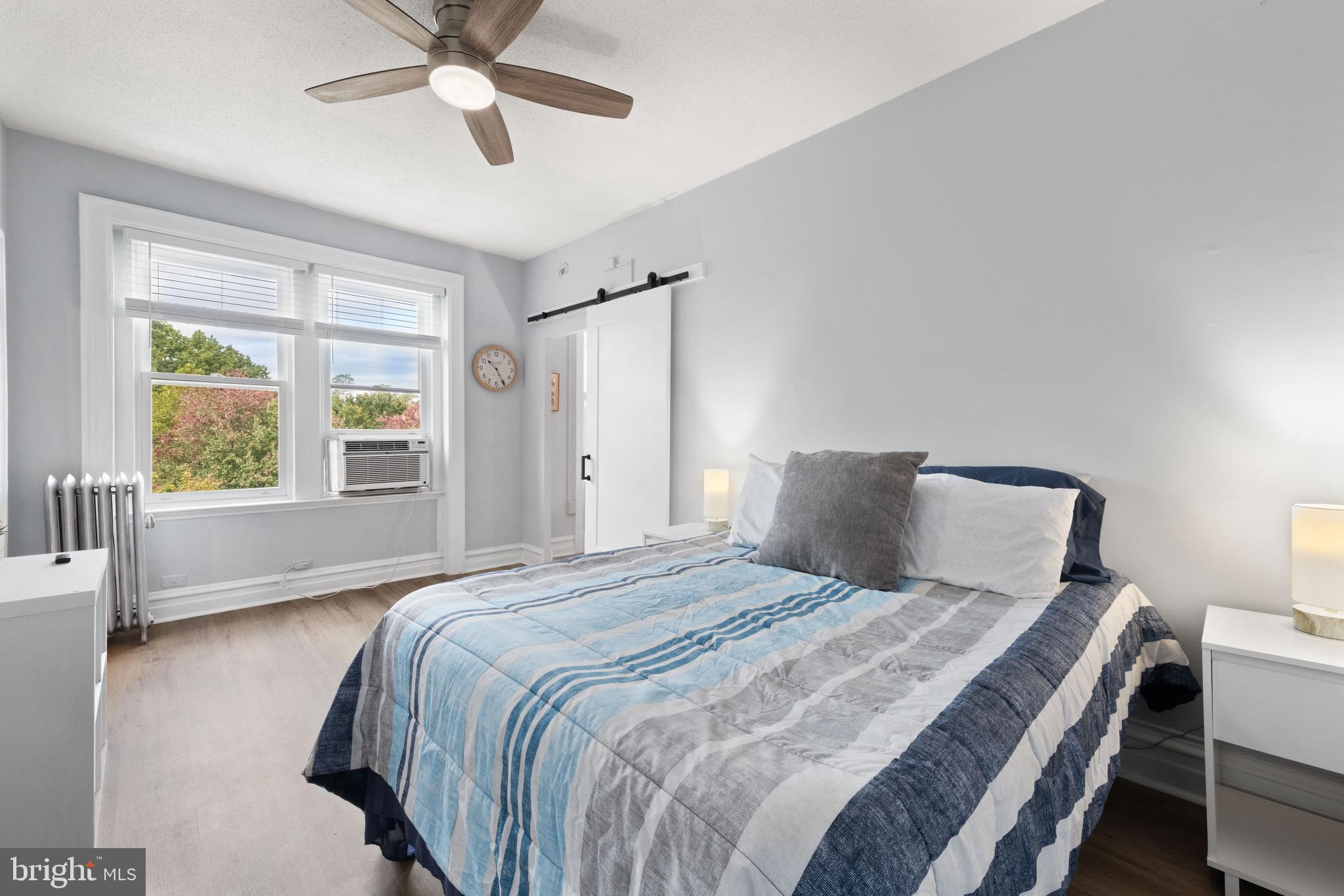 2456 20th Street Northwest, Unit 507 Washington, DC 20009 - Photo 28 of 42 a bedroom with a bed and window