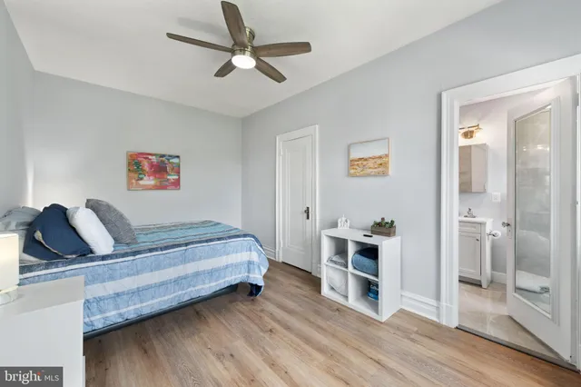 a bedroom with a bed and a chair