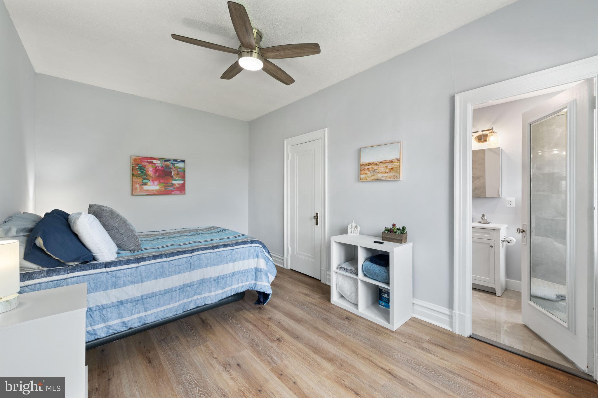 2456 20th Street Northwest, Unit 507 Washington, DC 20009 - Photo 29 of 42 a bedroom with furniture and wooden floor
