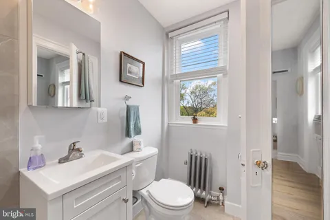 a bathroom with a shower and a toilet