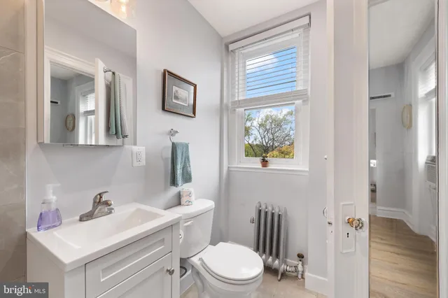 a bathroom with a shower and a toilet