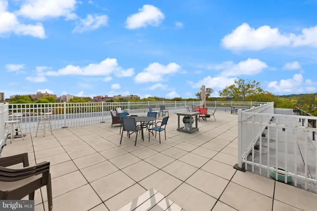 a view of a terrace with furniture and a table