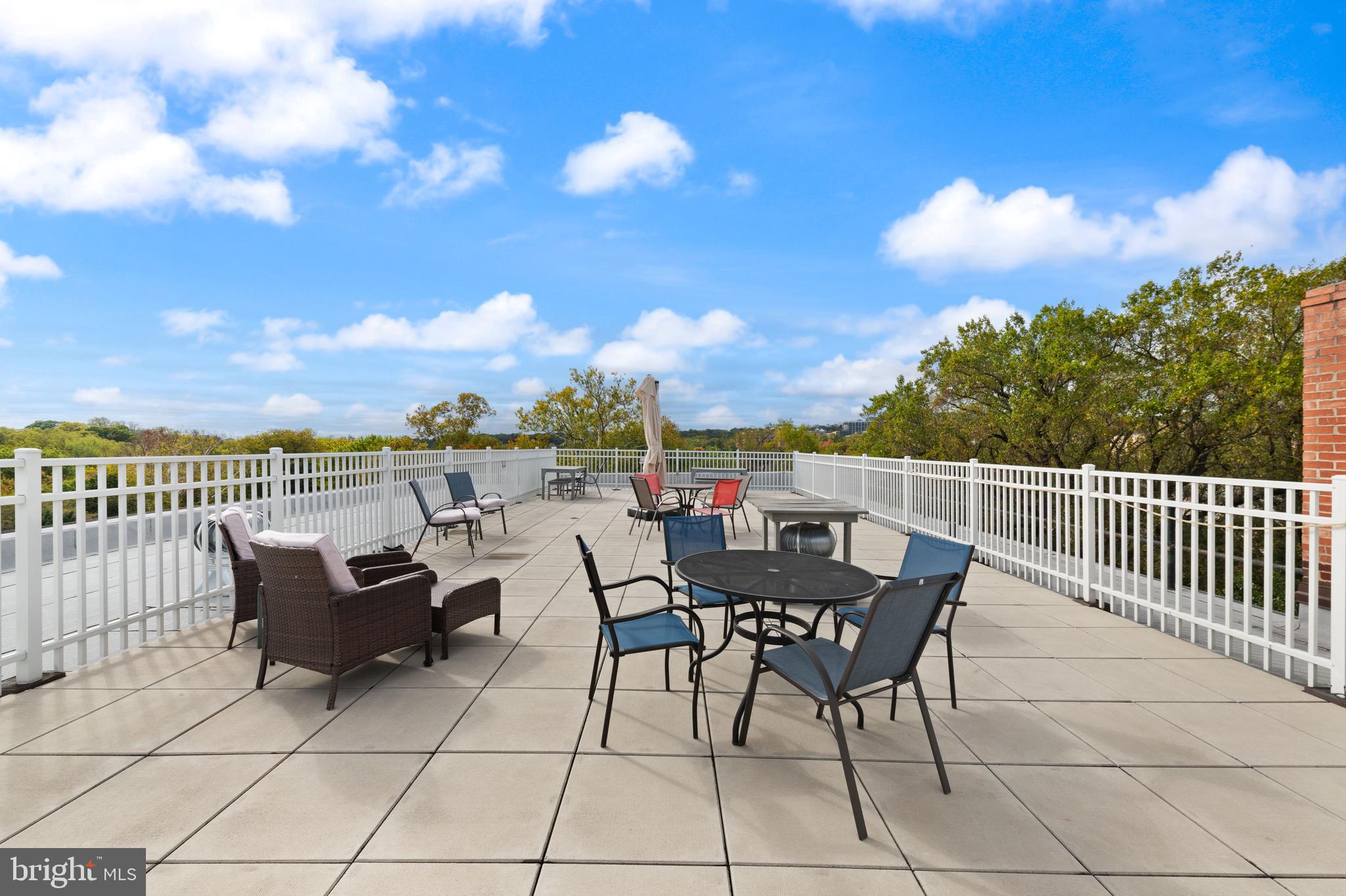 2456 20th Street Northwest, Unit 507 Washington, DC 20009 - Photo 39 of 42 a view of a terrace with furniture and a table