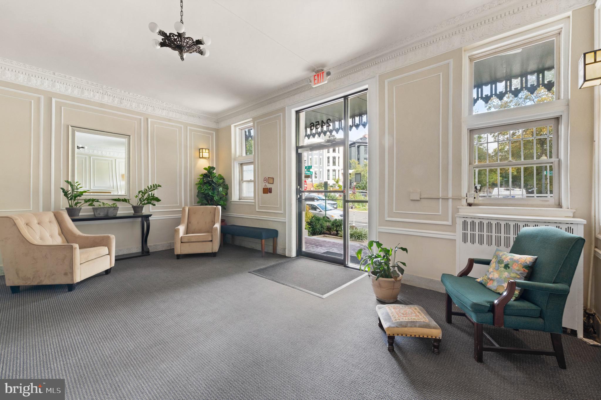 2456 20th Street Northwest, Unit 507 Washington, DC 20009 - Photo 8 of 42 a living room with furniture and a large window