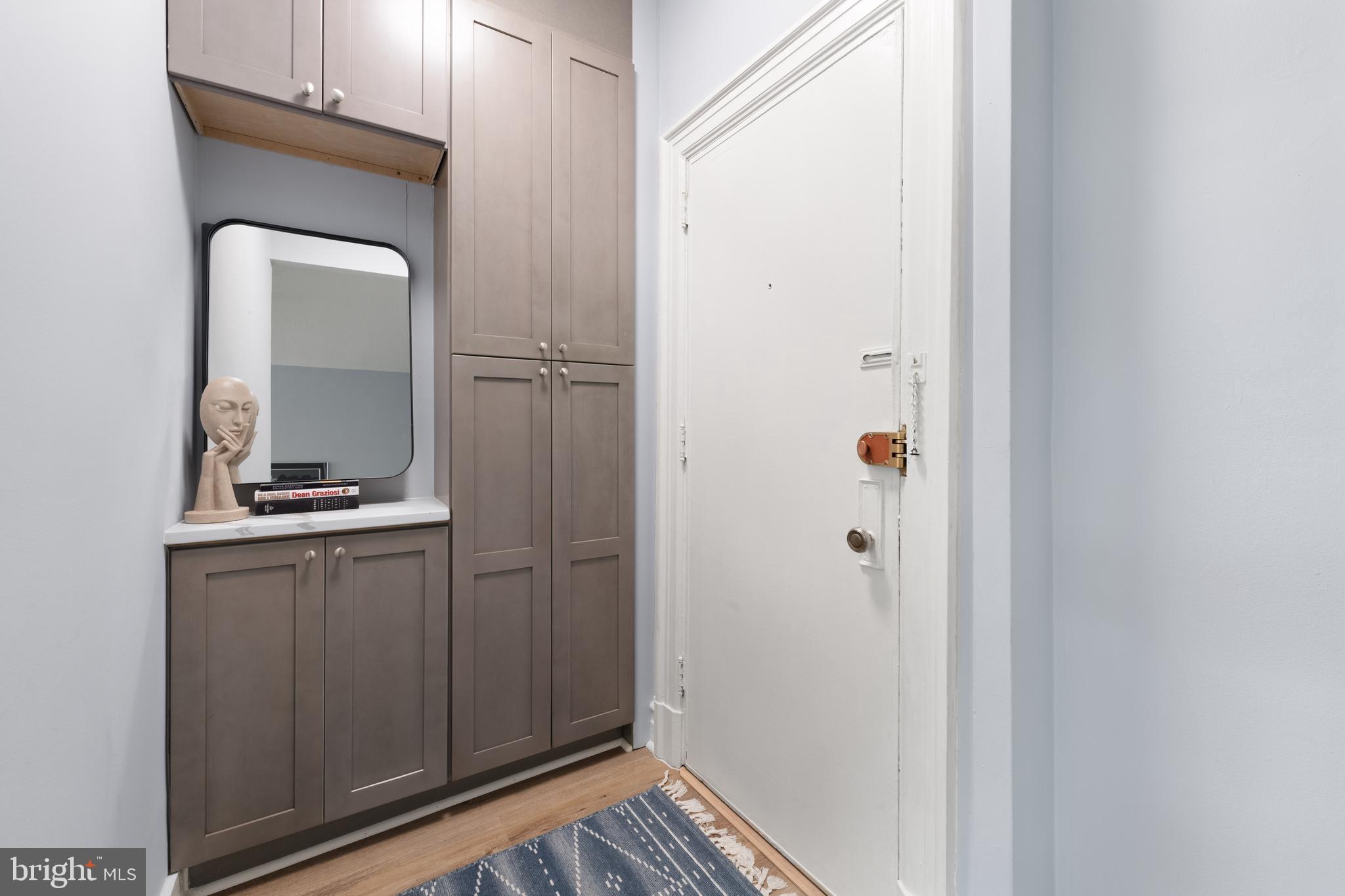 2456 20th Street Northwest, Unit 507 Washington, DC 20009 - Photo 10 of 42 a bathroom with a sink a mirror and a shower