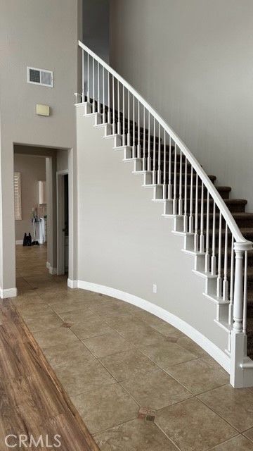811 Inverlochy Drive Fallbrook, CA 92028 - Photo 19 of 31 a view of a hallway with wooden floor and stairs