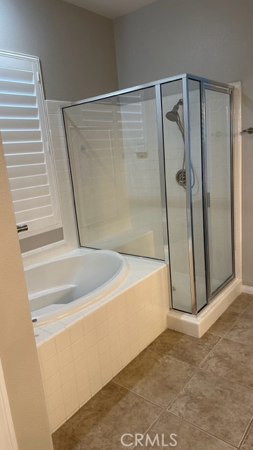 811 Inverlochy Drive Fallbrook, CA 92028 - Photo 20 of 31 a view of a bathroom with a tub and a shower