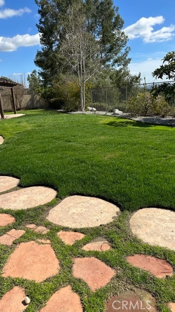811 Inverlochy Drive Fallbrook, CA 92028 - Photo 4 of 31 a backyard with grassy field and trees