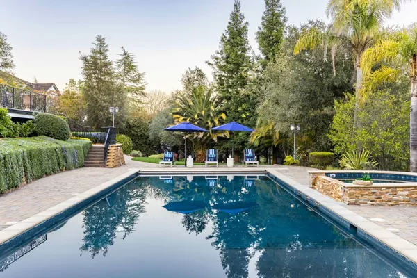 a view of swimming pool with chairs