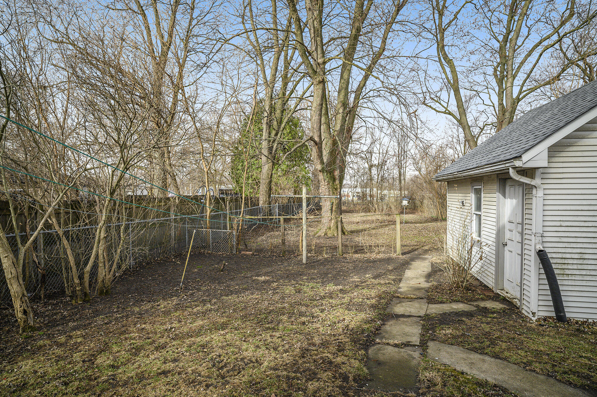 1013 Merrillville Road Crown Point, IN 46307 - Photo 14 of 16 a backyard of a house with lots of green space