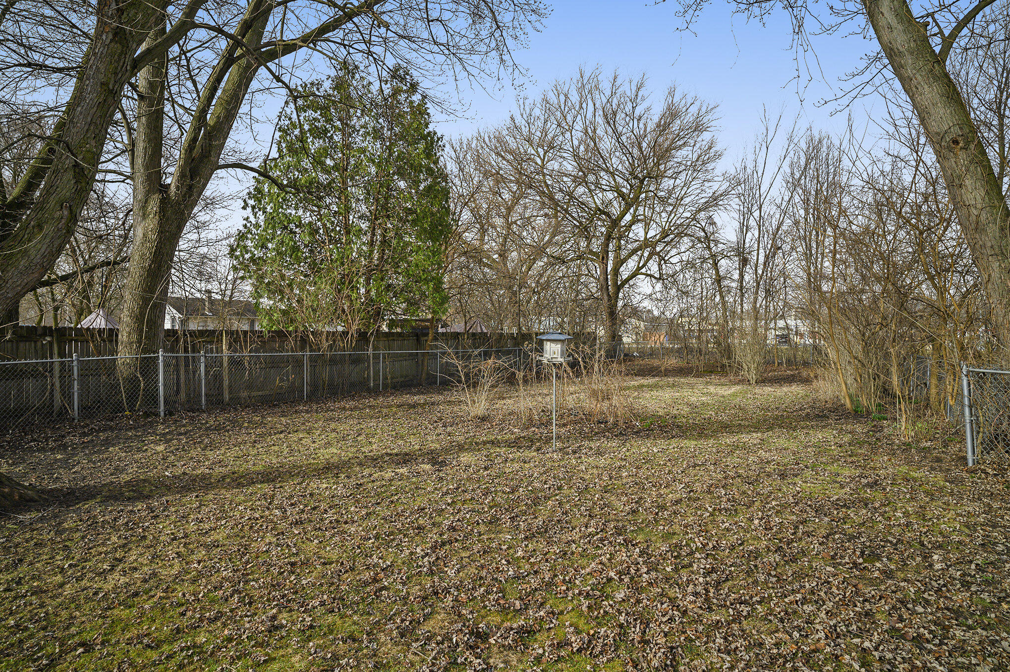 1013 Merrillville Road Crown Point, IN 46307 - Photo 16 of 16 a backyard of a house with lots of green space