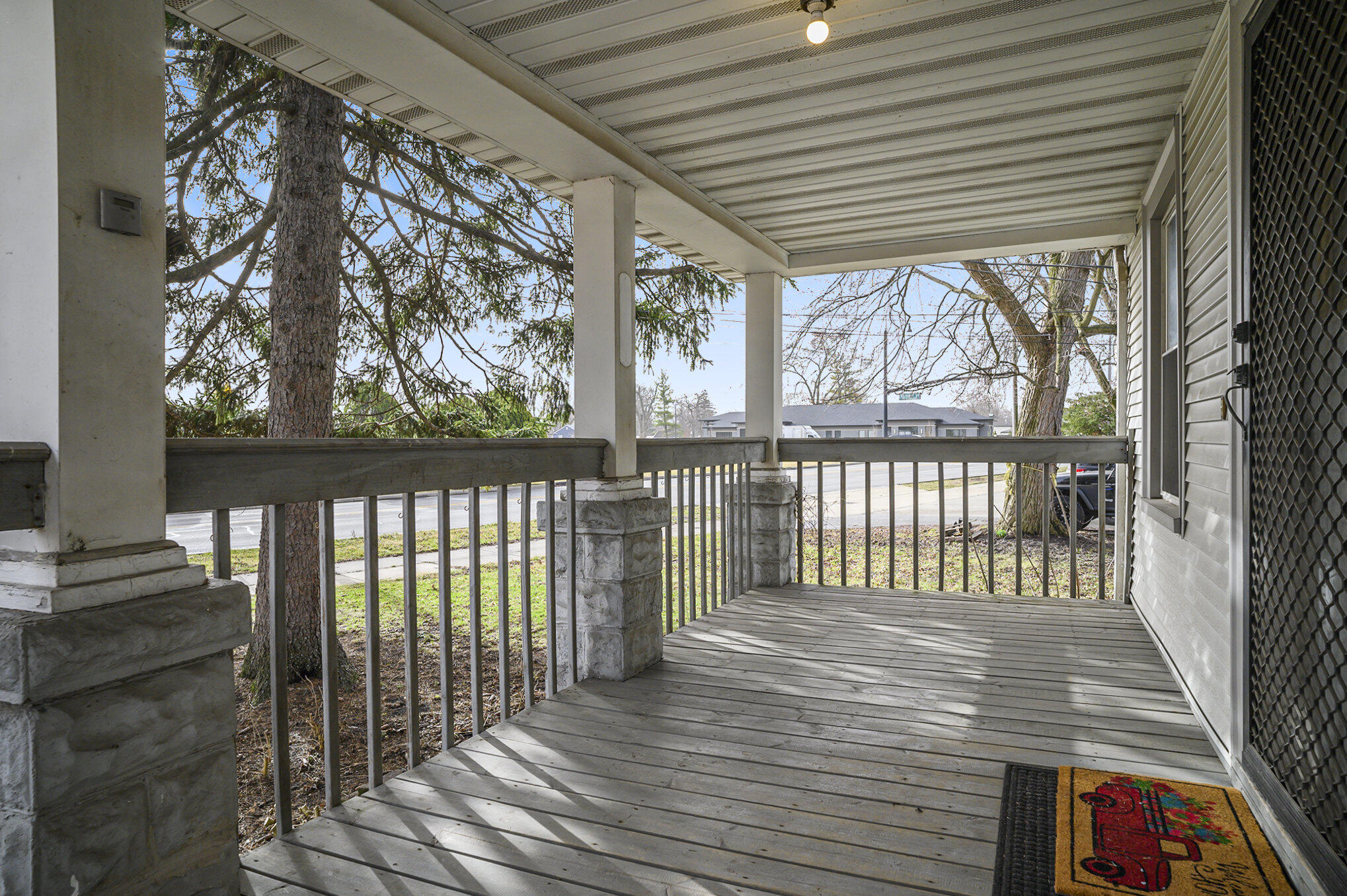 1013 Merrillville Road Crown Point, IN 46307 - Photo 3 of 16 a view of a porch with wooden floor