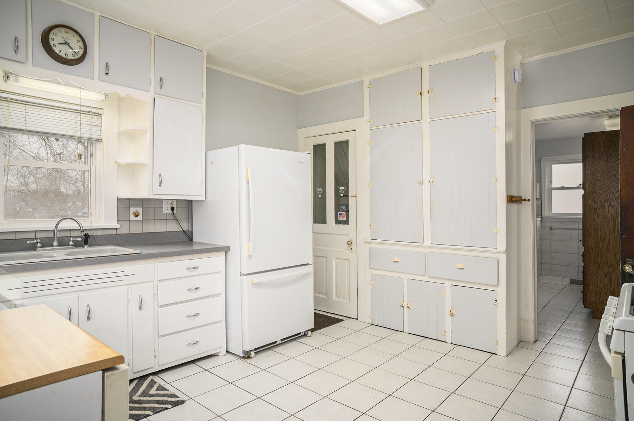 1013 Merrillville Road Crown Point, IN 46307 - Photo 8 of 16 a kitchen with white cabinets and white appliances