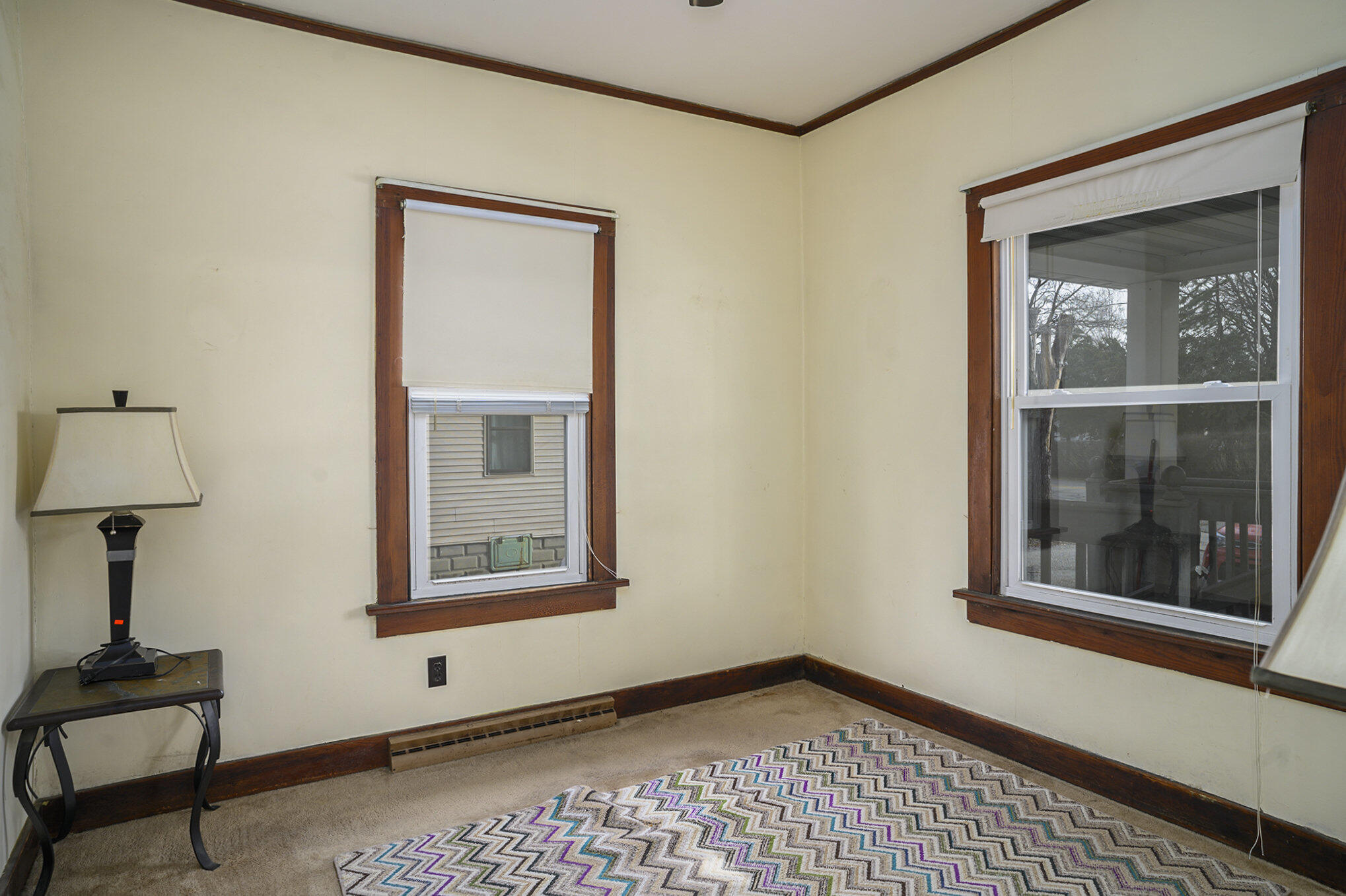 1013 Merrillville Road Crown Point, IN 46307 - Photo 10 of 16 a view of an empty room with window and wooden floor