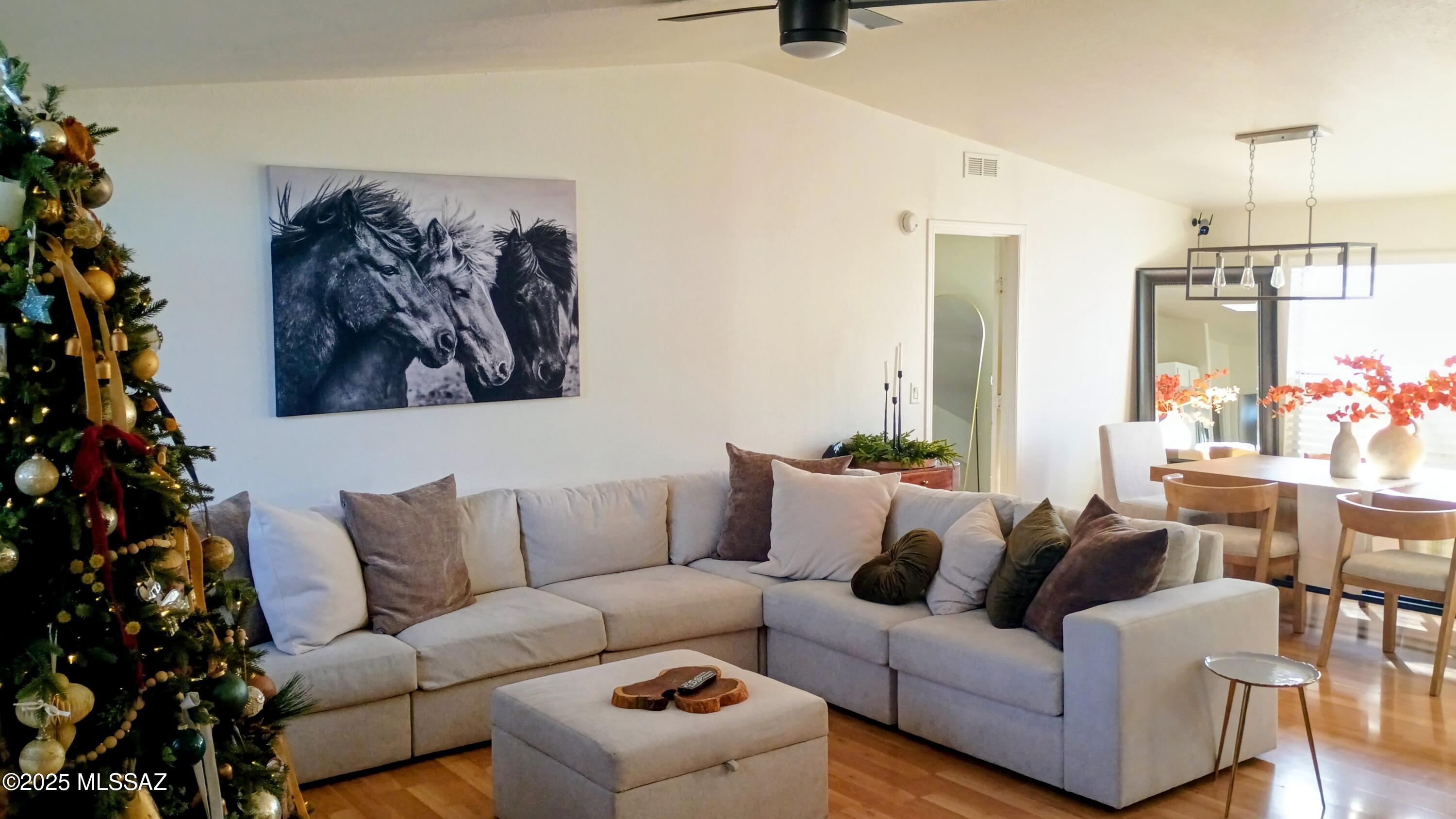 1449 West Hualpai Road Tucson, AZ 85745 - Photo 7 of 49 a living room with furniture and a chandelier