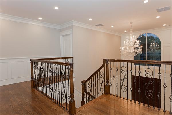 56 Broken Tree Road Newton, MA 02459 - Photo 28 of 30 a view of a hallway with wooden floor and windows