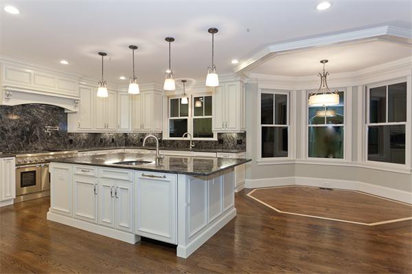 56 Broken Tree Road Newton, MA 02459 - Photo 30 of 30 a large kitchen with kitchen island a sink and a large window